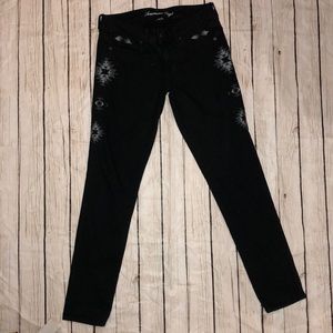 Black skinny jeans with stitch detailing
